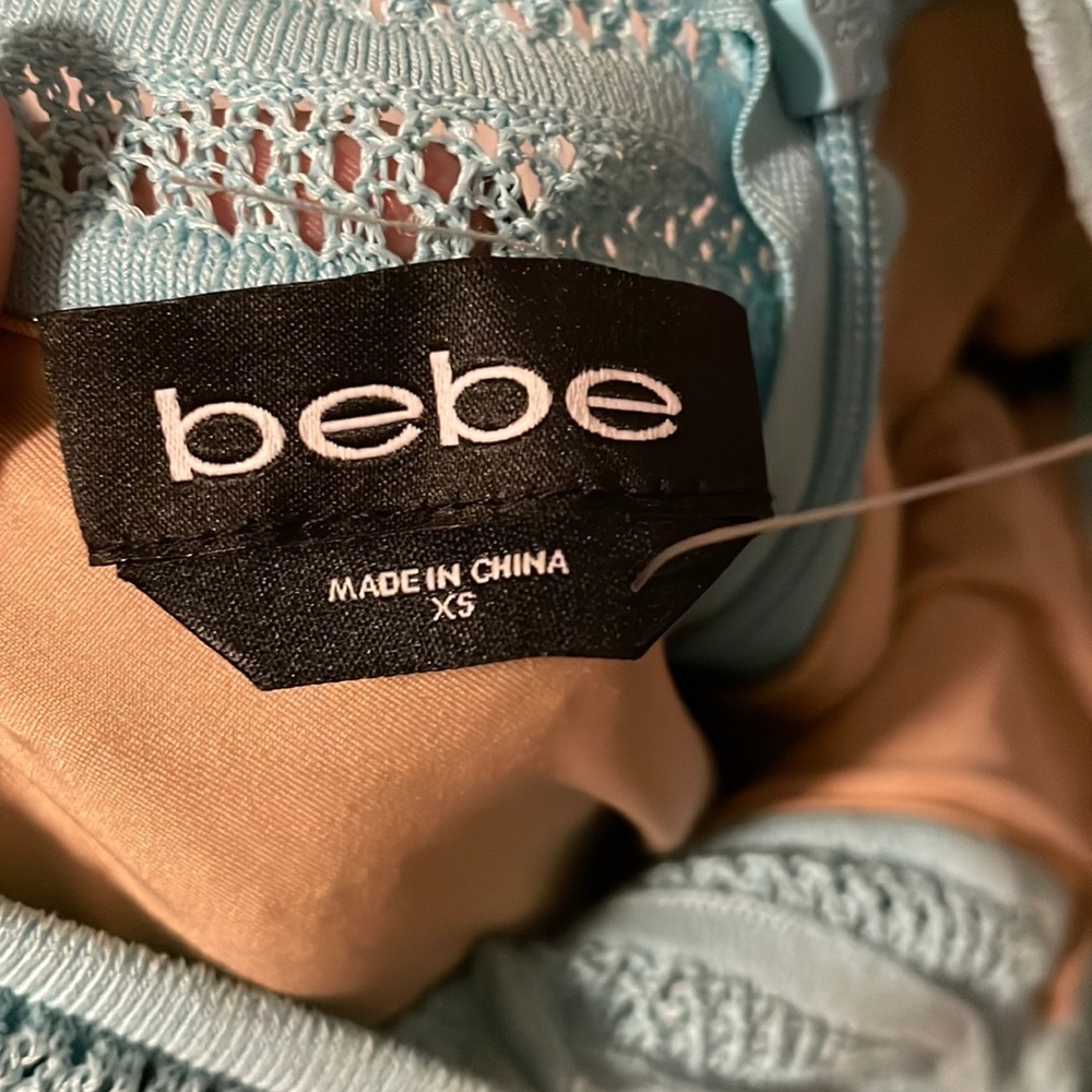 Beautiful bebe mini dress, turquoise color, shapes your body nice